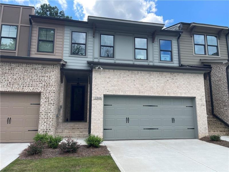 Front exterior of a new home in The Collection at Wolf Creek, Lawrenceville, GA, highlighting curb appeal (Image 7).