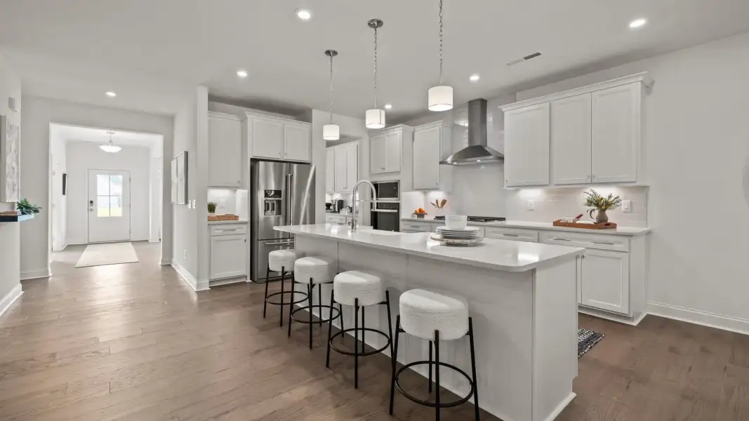 The Townsend Design gourmet kitchen with wall oven and built-in microwave at Lakeside Glen by DRB Homes in York, SC. The Townsend Design gourmet kitchen with wall oven and built-in microwave at Lakeside Glen by DRB Homes in York, SC.
