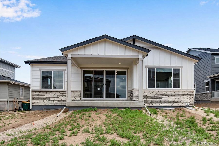 Exterior details and patio area of a home in Ensemble at The Aurora Highlands, Aurora (Image 23).