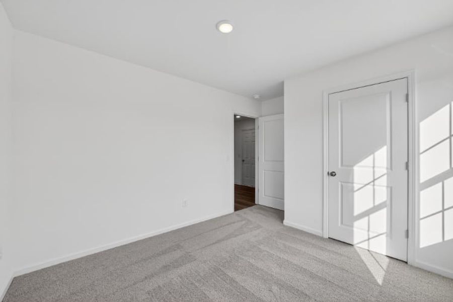 A hallway with white doors.