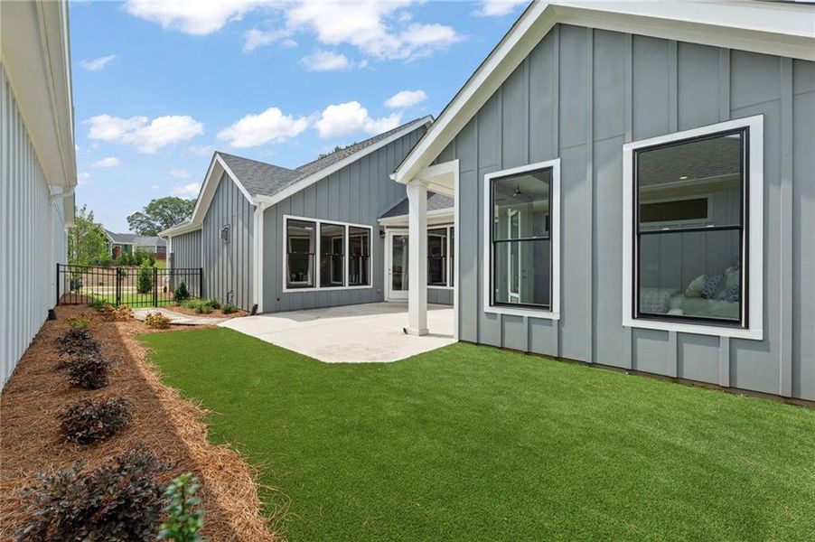 Front exterior of a new home in The Courtyards at Bailey Farm, Dacula, GA, highlighting curb appeal (Image 17).