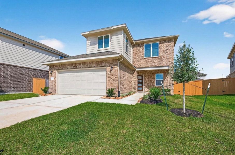 Front exterior of a new home in Sunterra, Katy, TX, highlighting curb appeal (Image 1). Front exterior of a new home in Sunterra, Katy, TX, highlighting curb appeal (Image 1).