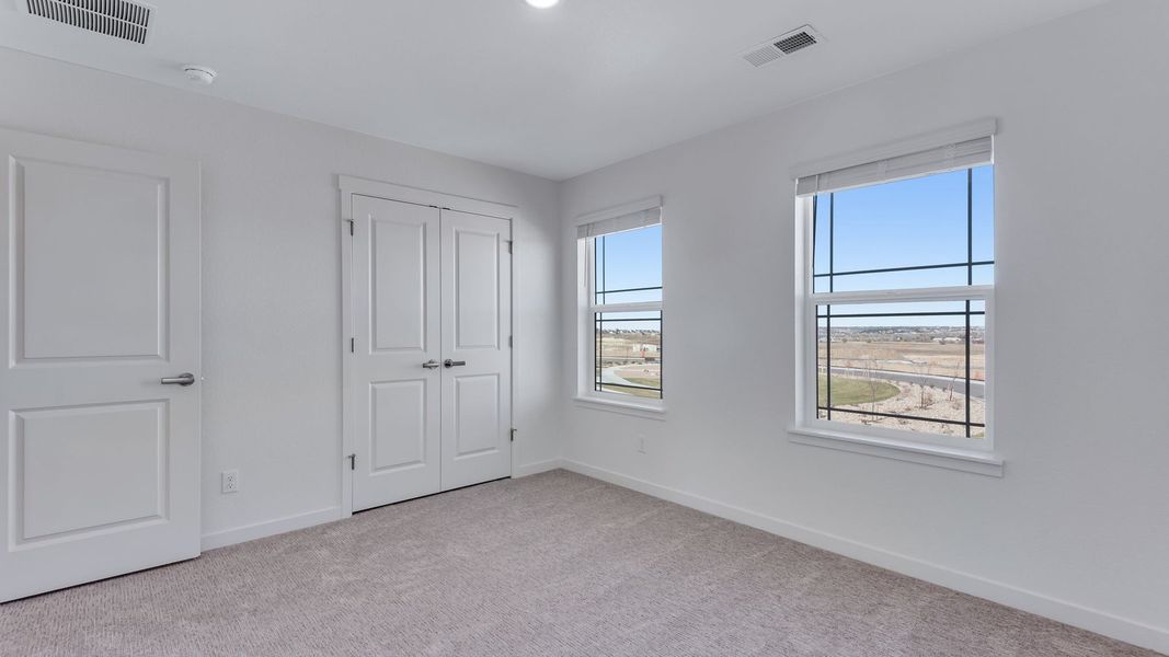 Spacious, unfurnished interior of a new home in Trails at Crowfoot, Parker (Image 20).