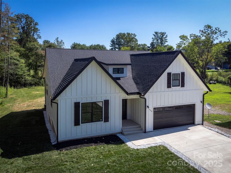 Front exterior of a new home in , Hendersonville, NC, highlighting curb appeal (Image 30).