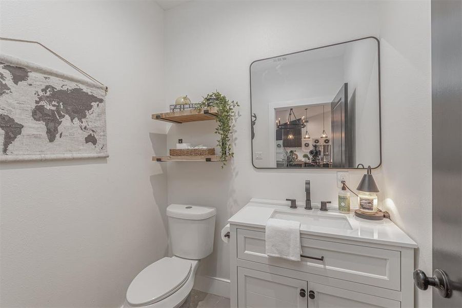 Bathroom with vanity and toilet