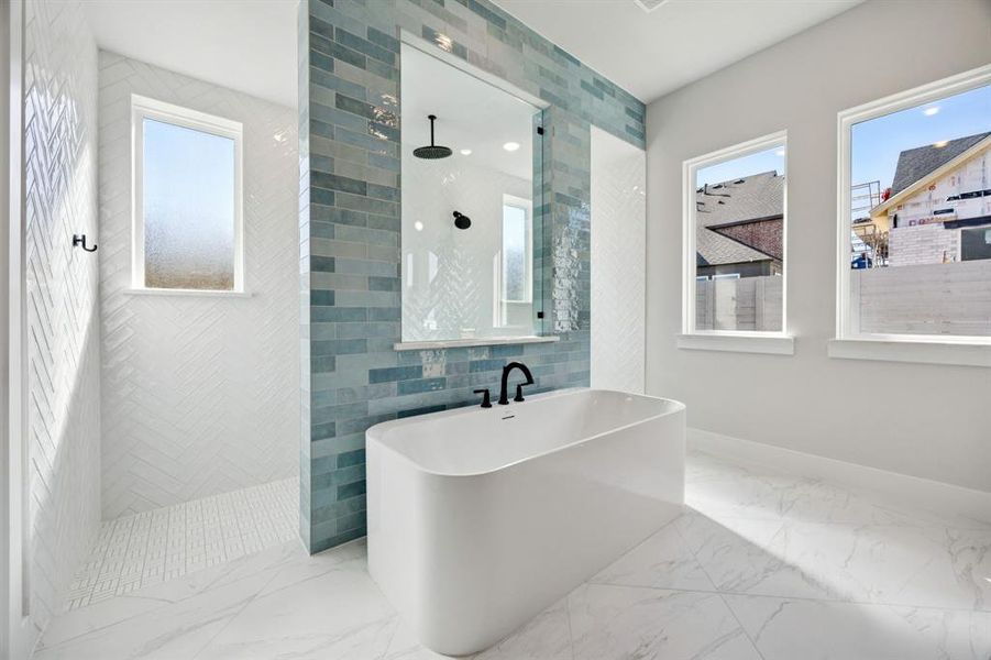 You'll enjoy a spa like experience every day with our signature owner's bath featuring a walk through shower with freestanding tub.