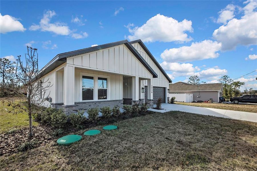 Front exterior of a new home in , Brooksville, FL, highlighting curb appeal (Image 27).