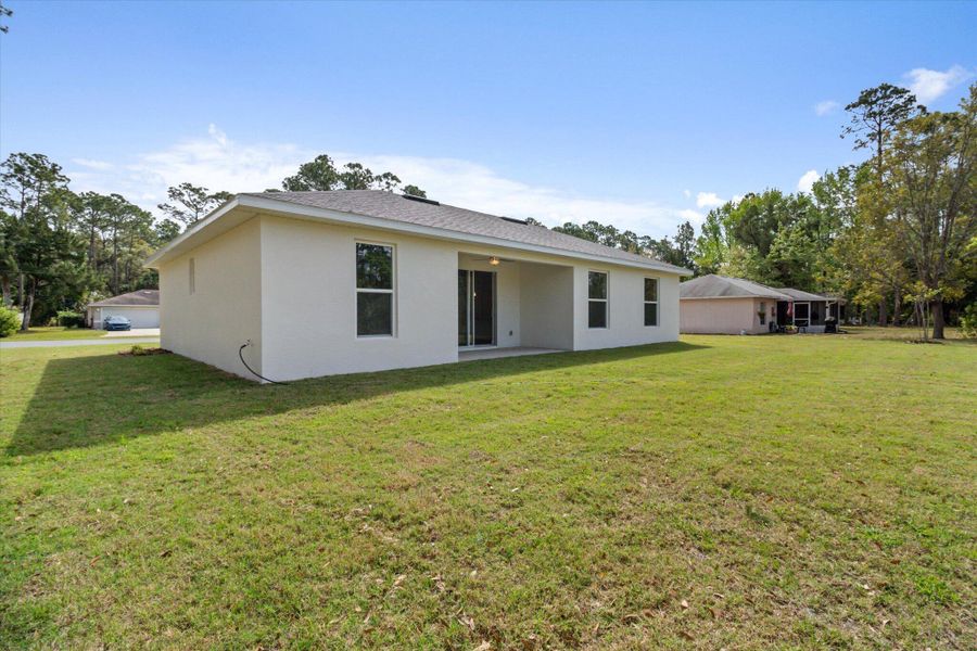 Front exterior of a new home in , Palm Coast, FL, highlighting curb appeal (Image 15).