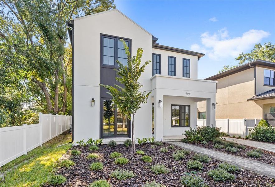 Front exterior of a new home in , Orlando, FL, highlighting curb appeal (Image 2). Front exterior of a new home in , Orlando, FL, highlighting curb appeal (Image 2).
