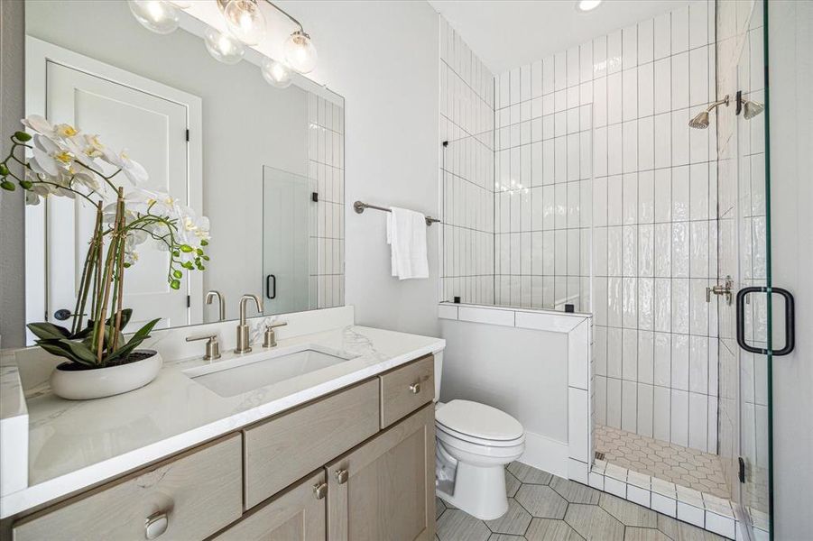 Pool bath. This bath has a door to the covered patio.