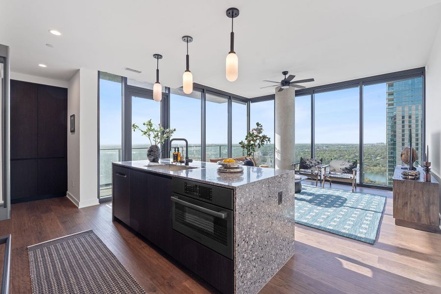 Representative Photo. The residence features the Industrial Rainey scheme which includes Italkraft carbon marine wood Italian cabinetry and terrazzo-quartz countertops, and Bosch stainless steel appliances.