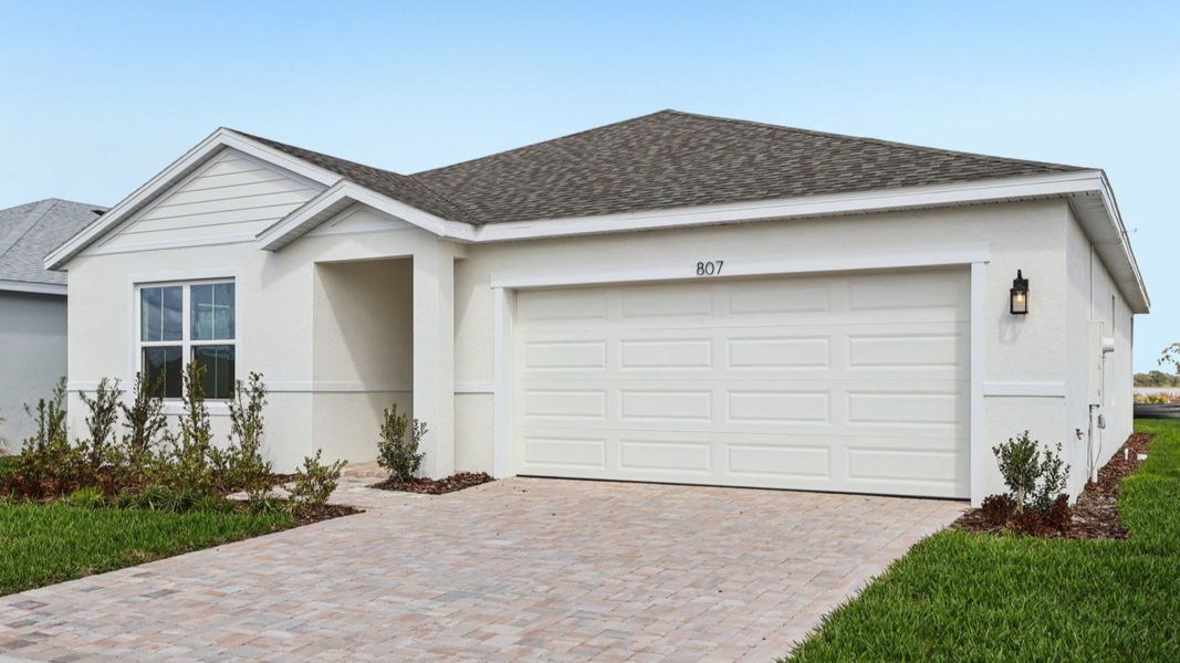 Representative exterior photo of a completed home built from the Baker by DRB Homes in Hamilton Bluff, Haines City, FL (Image 24).