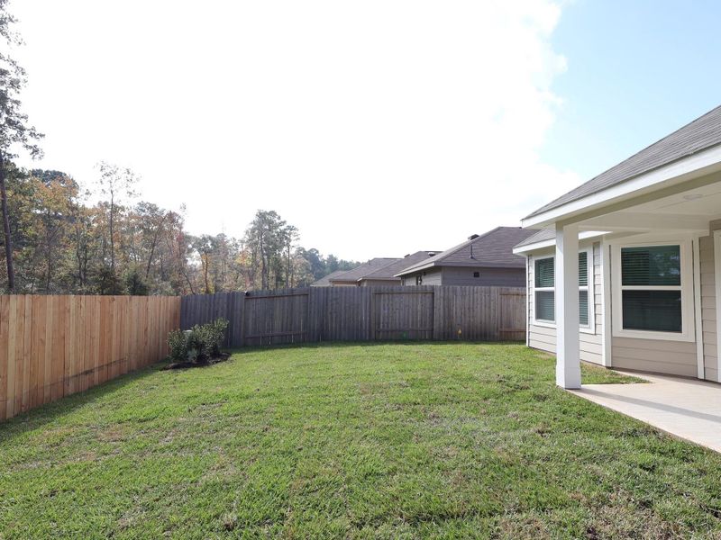 Exterior details and patio area of a home in Magnolia Ridge, Magnolia (Image 19).