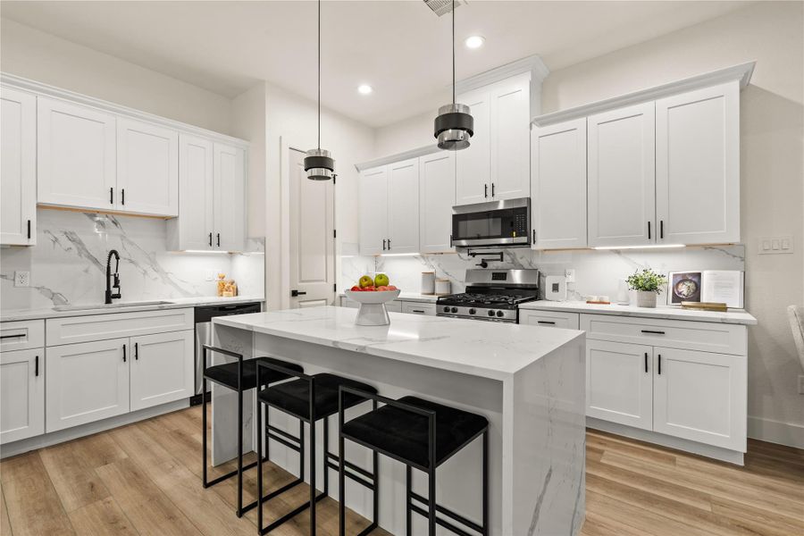 Full kitchen layout — clean cabinetry, quartz surfaces, and room on all sides Full kitchen layout — clean cabinetry, quartz surfaces, and room on all sides