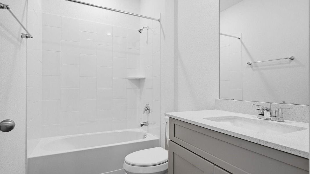 Primary bathroom with a glass-enclosed standing shower and separate soaking tub.