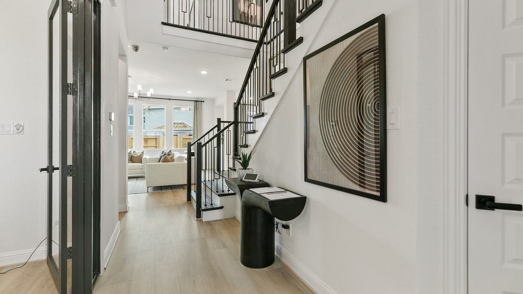 Representative furnished interior of a home built from the Mimosa by Brightland Homes in Sunterra, Katy (Image 5).