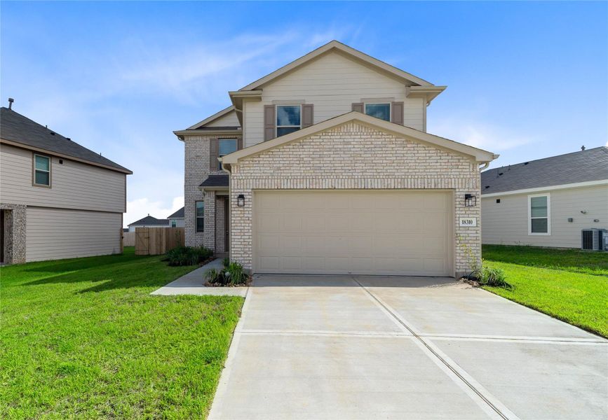 Front exterior of a new home in Oakwood Trails, Tomball, TX, highlighting curb appeal (Image 2). Front exterior of a new home in Oakwood Trails, Tomball, TX, highlighting curb appeal (Image 2).