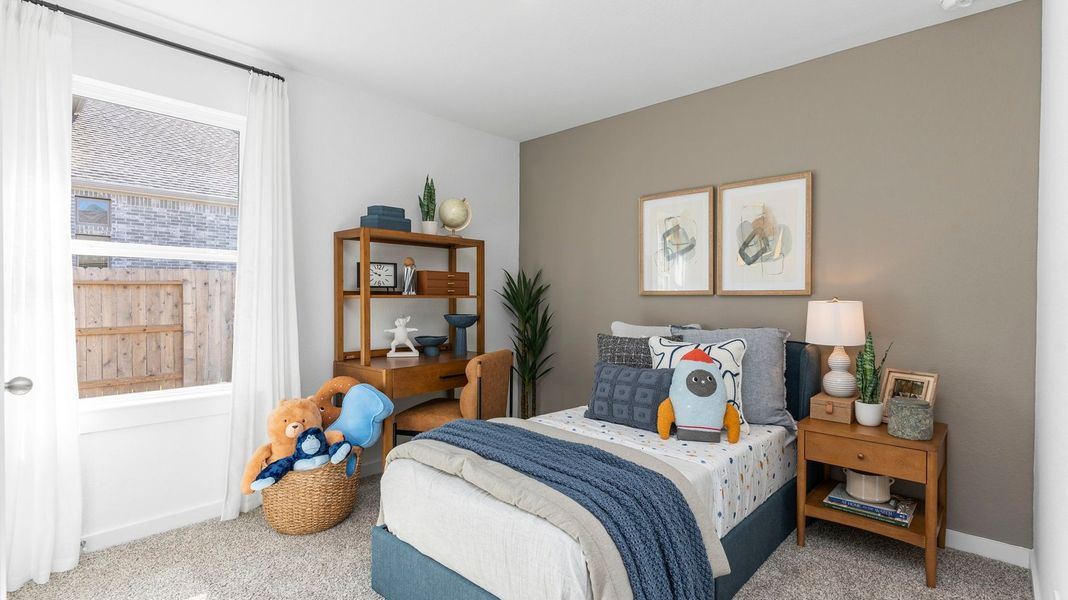 Furnished interior view inside a new home in Caldwell Crossing, Iowa Colony (Image 16).