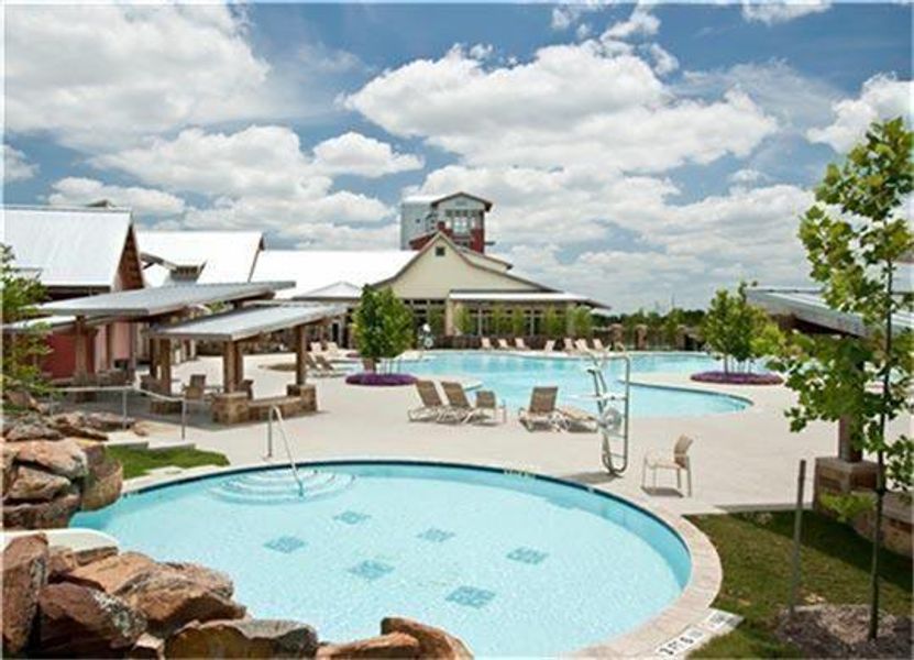 Dive into resort-style living at Cross Creek Ranch! This is just one of three sparkling pools residents enjoy, complete with a splash pad and scenic lake views. Whether you’re cheering on the neighborhood swim team or relaxing poolside under the Texas sun, every day feels like a getaway. Don’t miss the iconic Lookout Tower in the distance—another hallmark of this vibrant community. Dive into resort-style living at Cross Creek Ranch! This is just one of three sparkling pools residents enjoy, complete with a splash pad and scenic lake views. Whether you’re cheering on the neighborhood swim team or relaxing poolside under the Texas sun, every day feels like a getaway. Don’t miss the iconic Lookout Tower in the distance—another hallmark of this vibrant community.