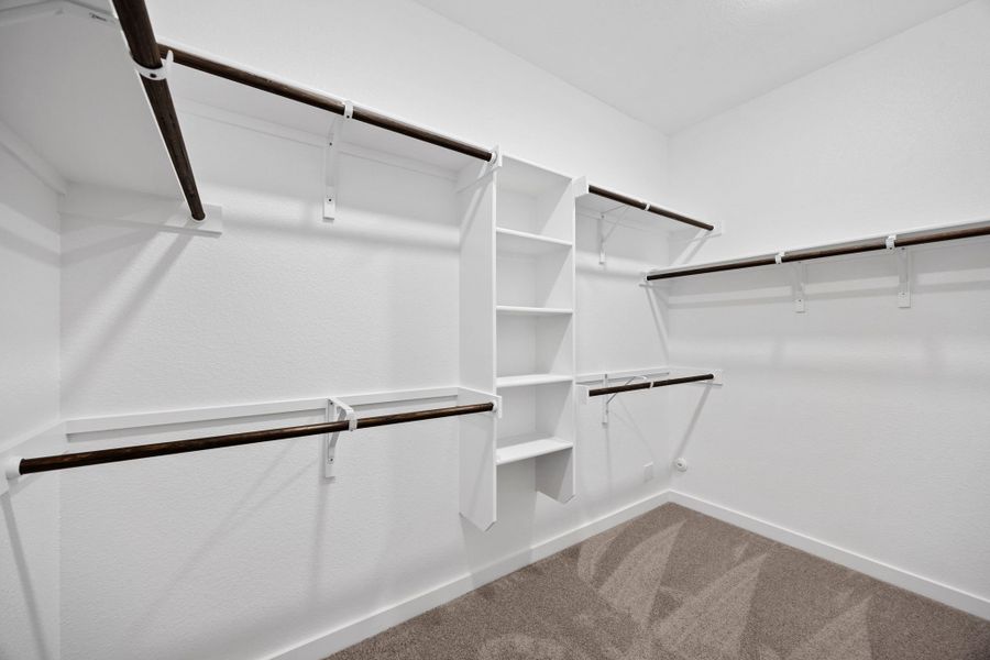 Primary Closet in the Mesquite home plan by Trophy Signature Homes – REPRESENTATIVE PHOTO Primary Closet in the Mesquite home plan by Trophy Signature Homes – REPRESENTATIVE PHOTO