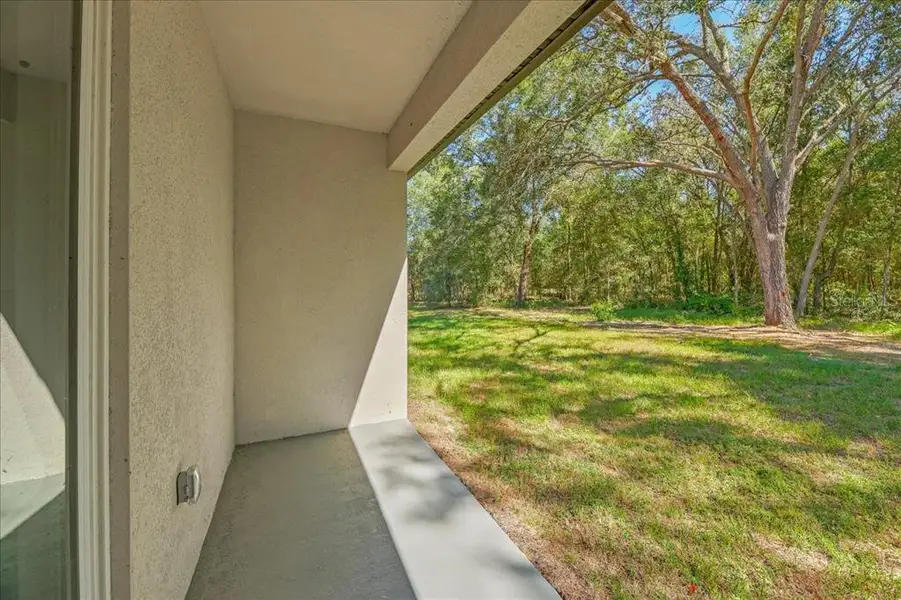 Exterior details and patio area of a home in , Citrus Springs (Image 3).