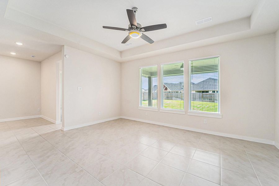This large family room is a blank canvas with views of the large backyard, located just off the kitchen. The extended covered back patio is perfect for relaxing after a long day This large family room is a blank canvas with views of the large backyard, located just off the kitchen. The extended covered back patio is perfect for relaxing after a long day