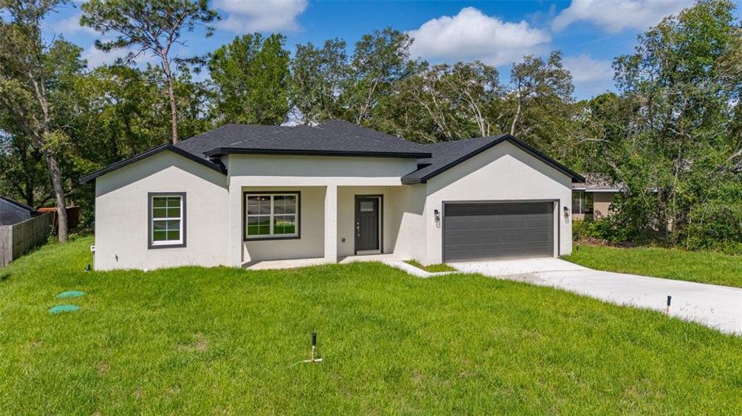 Front exterior of a new home in , Dunnellon, FL, highlighting curb appeal (Image 22).