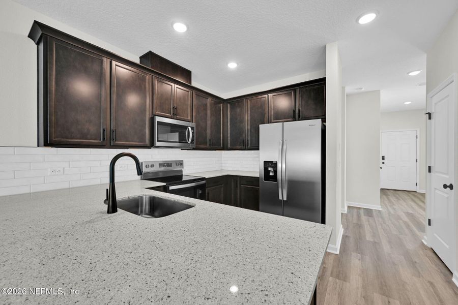Furnished interior view inside a new home in Baxley Villas, Middleburg (Image 6).