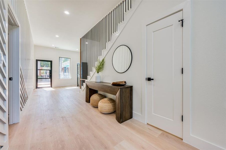 Foyer entrance featuring light hardwood / wood-style floors