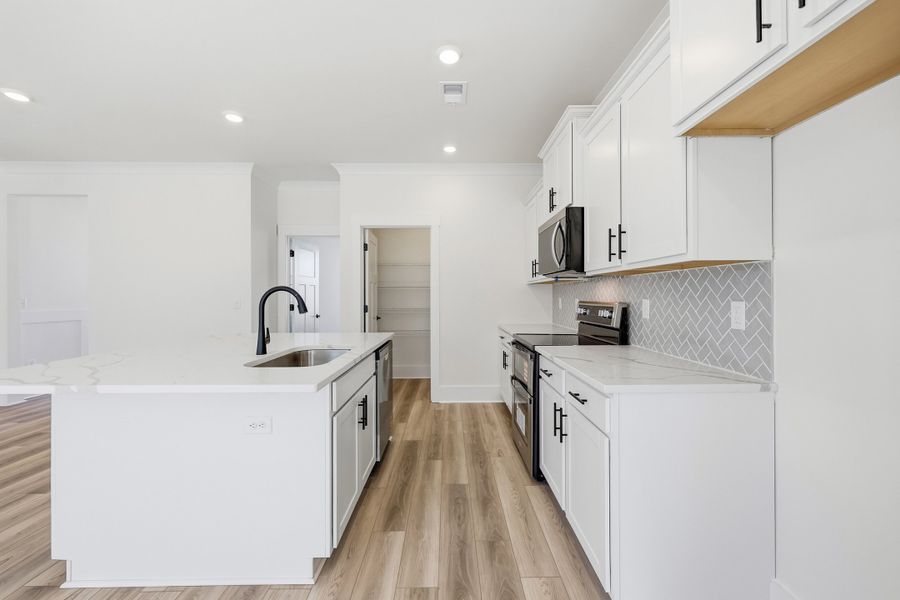 Representative furnished interior of a home built from the Montague II by Great Southern Homes in Oak Hollow, Longs (Image 11).