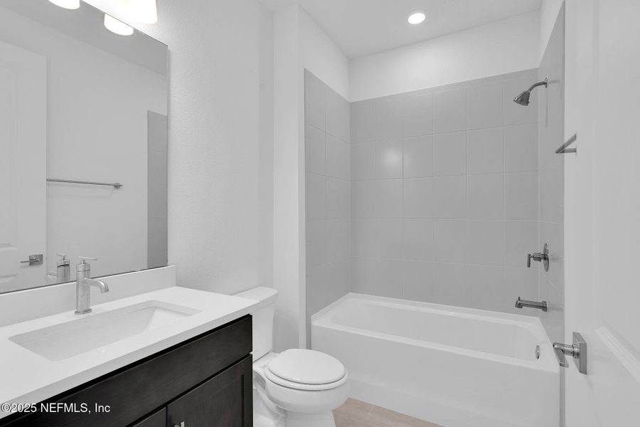 Furnished interior view inside a new home in Summer Bay at Grand Oaks, St. Augustine (Image 11).