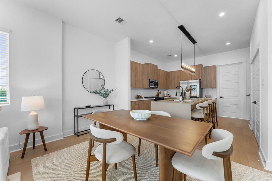 The dining area is seamlessly integrated into the open-concept kitchen, living, and dining space, offering plenty of room for a large dining table, perfect for hosting family gatherings, dinner parties, or everyday meals, while maintaining a bright, open, and inviting atmosphere.