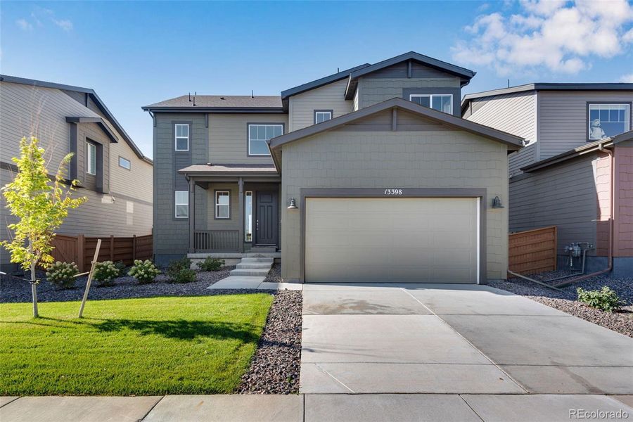 Front exterior of a new home in Reunion Ridge, Commerce City, CO, highlighting curb appeal (Image 22).