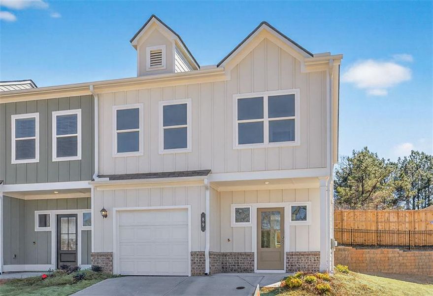 Front exterior of a new home in Fuller Station, Loganville, GA, highlighting curb appeal (Image 2). Front exterior of a new home in Fuller Station, Loganville, GA, highlighting curb appeal (Image 2).