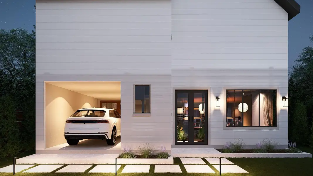 The property features a clean white exterior, an integrated garage with interior lighting, and a prominent front entry with double glass doors