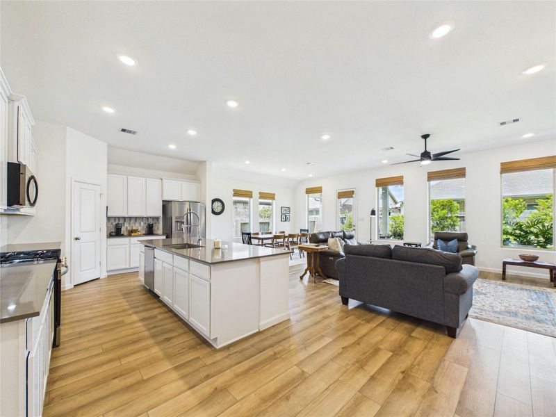As you enter the main area of the home you are greeted with a beautiful open space. The island kitchen seamlessly flows into the living room and dining space.