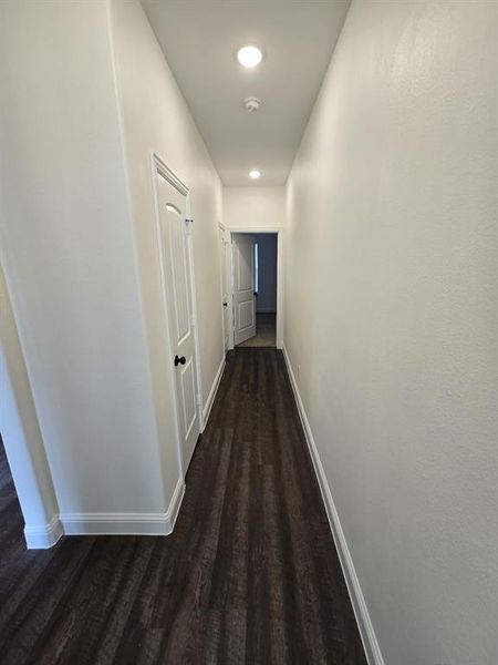 Hallway with wood-type flooring