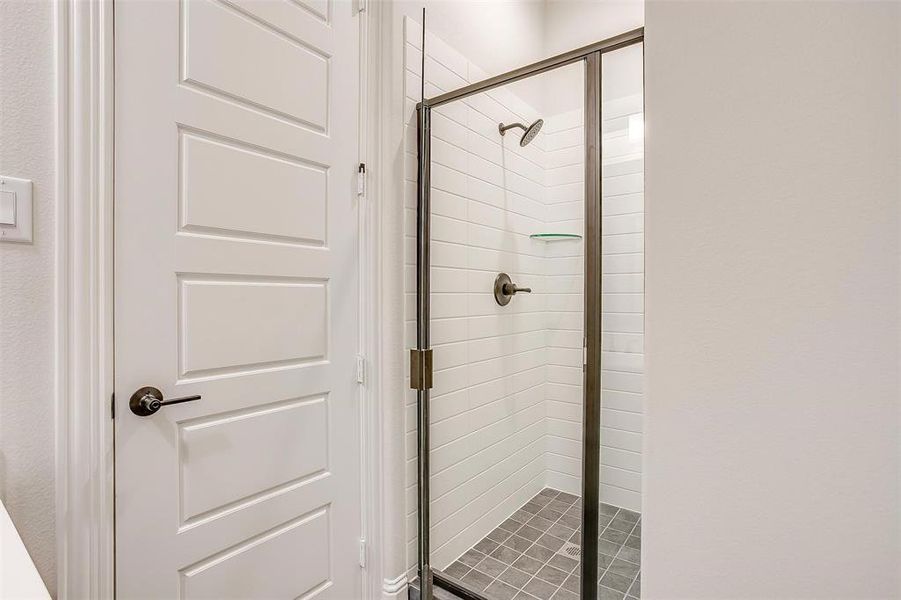 Bathroom with a shower with door