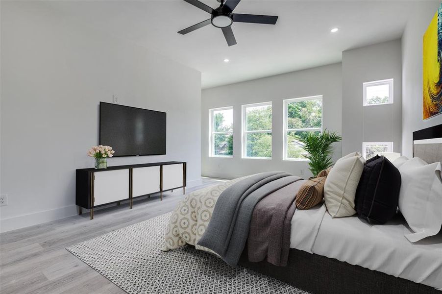 Bedroom with wood finished floors, multiple windows, recessed lighting, and ceiling fan Bedroom with wood finished floors, multiple windows, recessed lighting, and ceiling fan