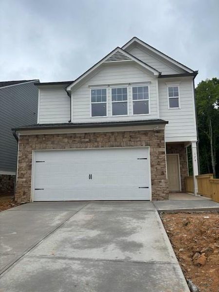 Front exterior of a new home in Castleberry Pointe, Dawsonville, GA, highlighting curb appeal (Image 1). Front exterior of a new home in Castleberry Pointe, Dawsonville, GA, highlighting curb appeal (Image 1).