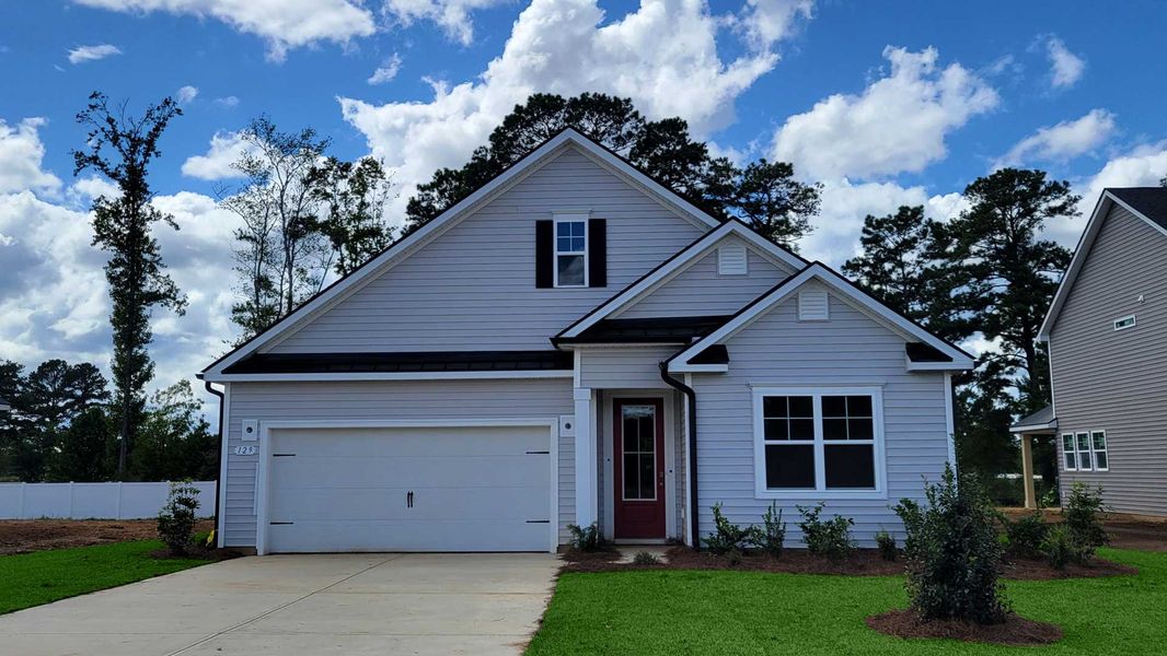 Front exterior of a new home in Coastal Farms, Conway, SC, highlighting curb appeal (Image 2). Front exterior of a new home in Coastal Farms, Conway, SC, highlighting curb appeal (Image 2).