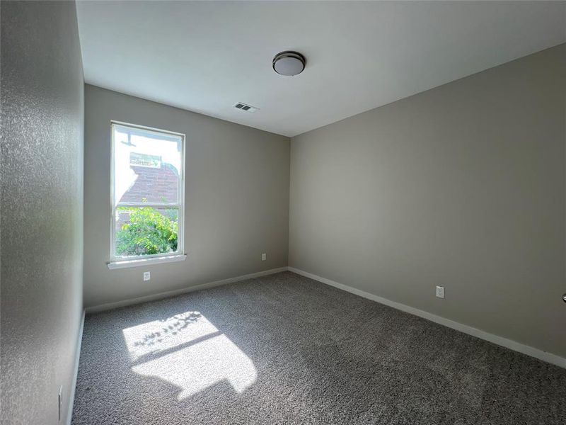 Unfurnished room with carpet