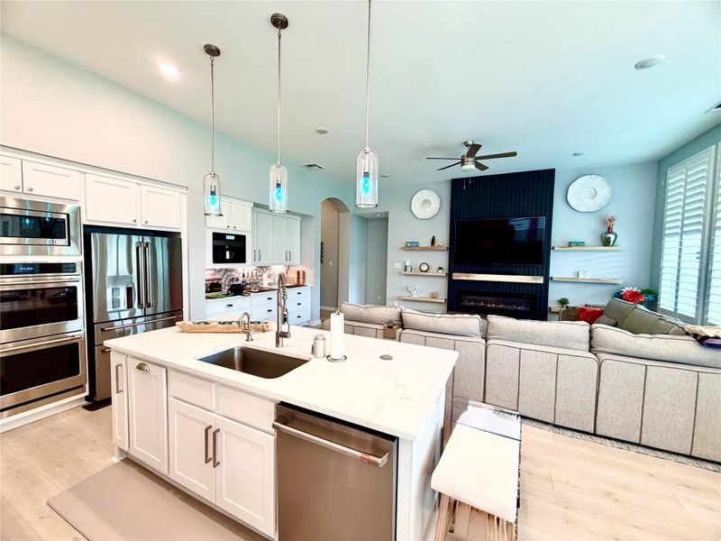 Kitchen overlooks Living RM and Back Yard. LOVESAC sectional for sale seperately Kitchen overlooks Living RM and Back Yard. LOVESAC sectional for sale seperately