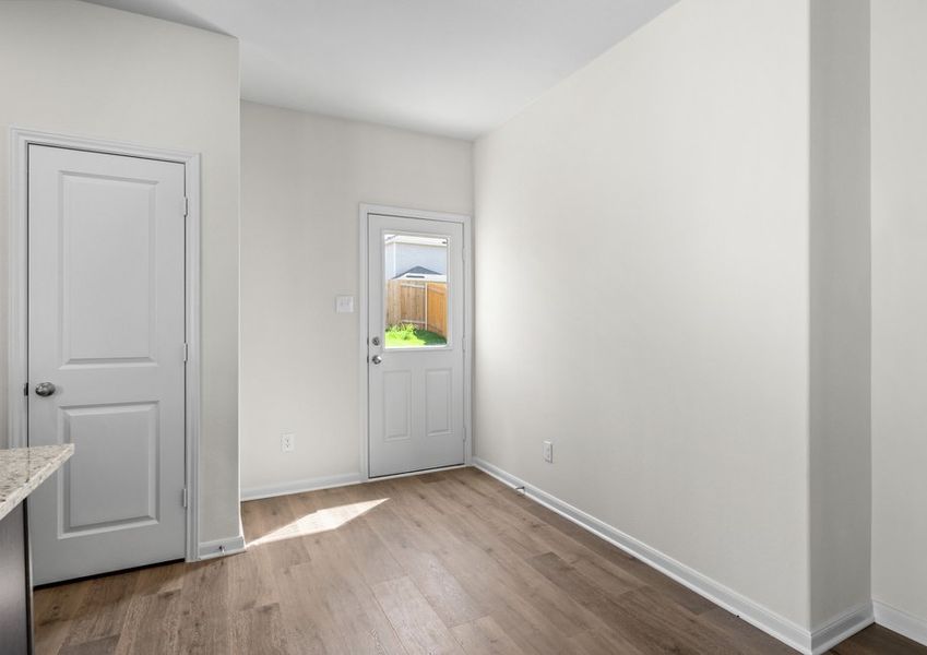 The dining area sits adjacent to the kitchen.