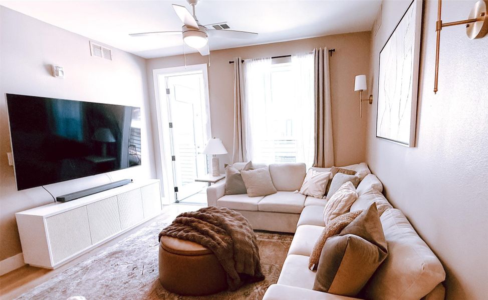 Living area featuring ceiling fan