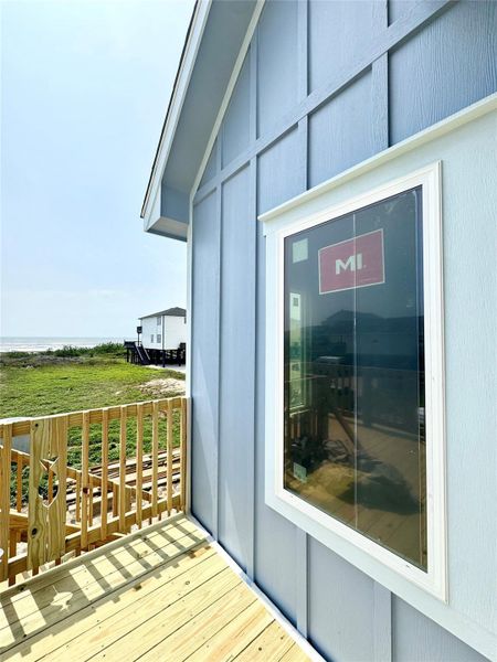 Love the house color and trim combo. Peep the ocean view!