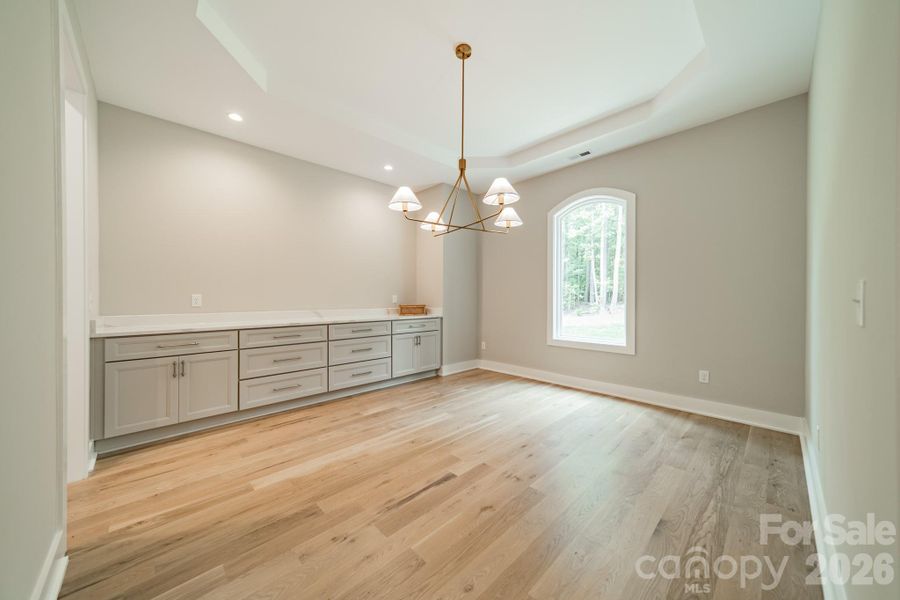 Entertain in Style in the grand Dining Room with built-in Cabinetry and Quartz Countertops