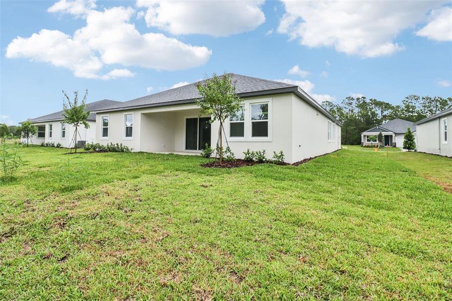 Exterior details and patio area of a home in Ridgehaven - Reserve Series, Ormond Beach (Image 23).