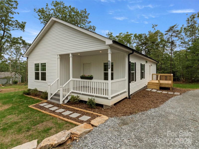 Front exterior of a new home in , Hendersonville, NC, highlighting curb appeal (Image 1).