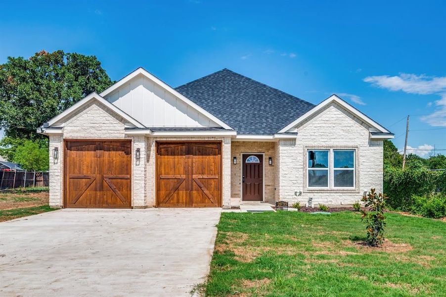 View of front of home featuring a front lawn